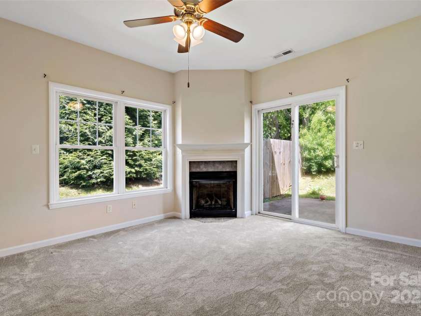 8 Cherry Laurel Lane, Swannanoa, NC 28778.  MLS# CAR4254009, YatesRealty ID 12369. Gas fireplace in open living area