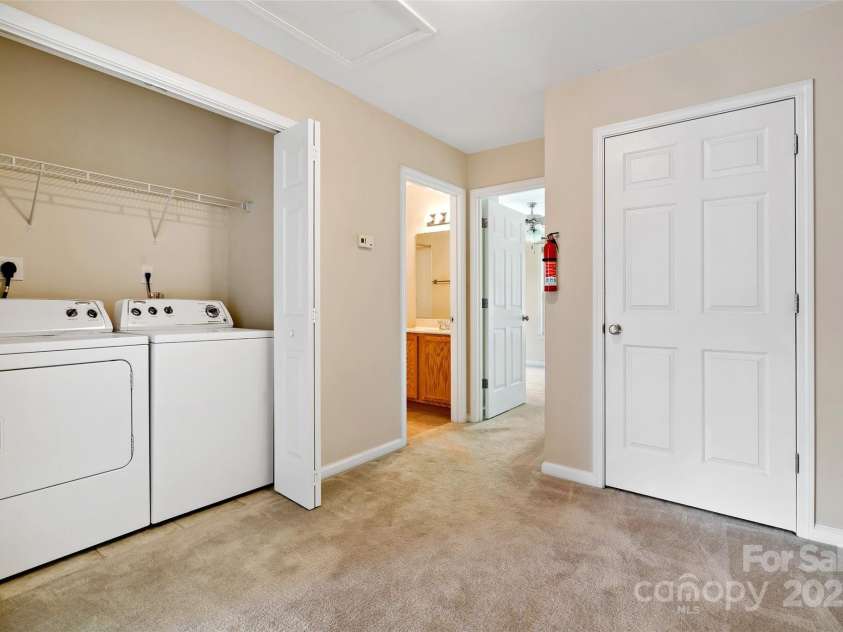 8 Cherry Laurel Lane, Swannanoa, NC 28778.  MLS# CAR4254009, YatesRealty ID 12369. Upstairs hallway with laundry and closet