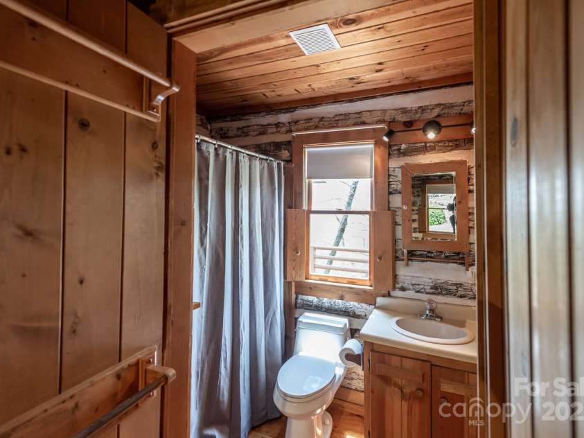 1303 Homestead Road, Todd, NC 28684.  MLS# CAR4257419, YatesRealty ID 12370. Main level guest bath