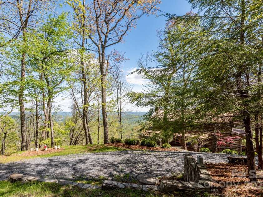 1303 Homestead Road, Todd, NC 28684.  MLS# CAR4257419, YatesRealty ID 12370. Native hardwoods and circular drive