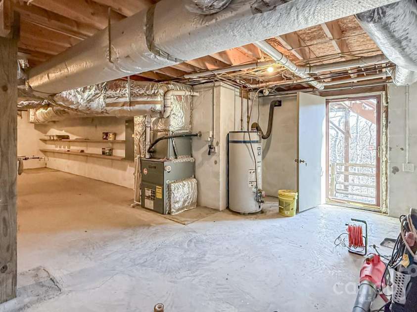 1303 Homestead Road, Todd, NC 28684.  MLS# CAR4257419, YatesRealty ID 12370. Unfinished basement offers great storage space for all of the mountain toys