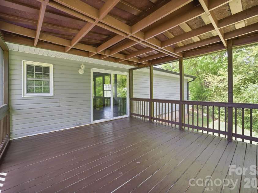 219 Breezewood Drive, Charlotte, NC 28262.  MLS# CAR4346086, YatesRealty ID 12375. Spacious screened porch