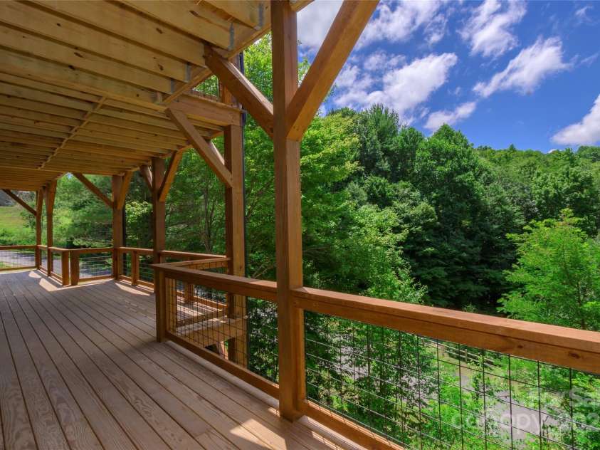 750 Silver Springs Drive, Banner Elk, NC 28604.  MLS# CAR4160928, YatesRealty ID 1238. Over 1,200 square feet of outdoor space including main level porte-cochere, covered porches with majestic, private mountain & neighborhood pond views