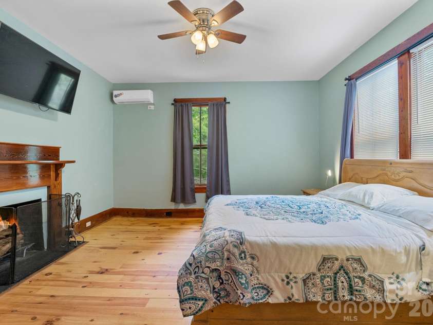305 Ficker Circle, Hendersonville, NC 28739.  MLS# CAR4240043, YatesRealty ID 12380. Second-floor bedroom with walkthrough to full bath