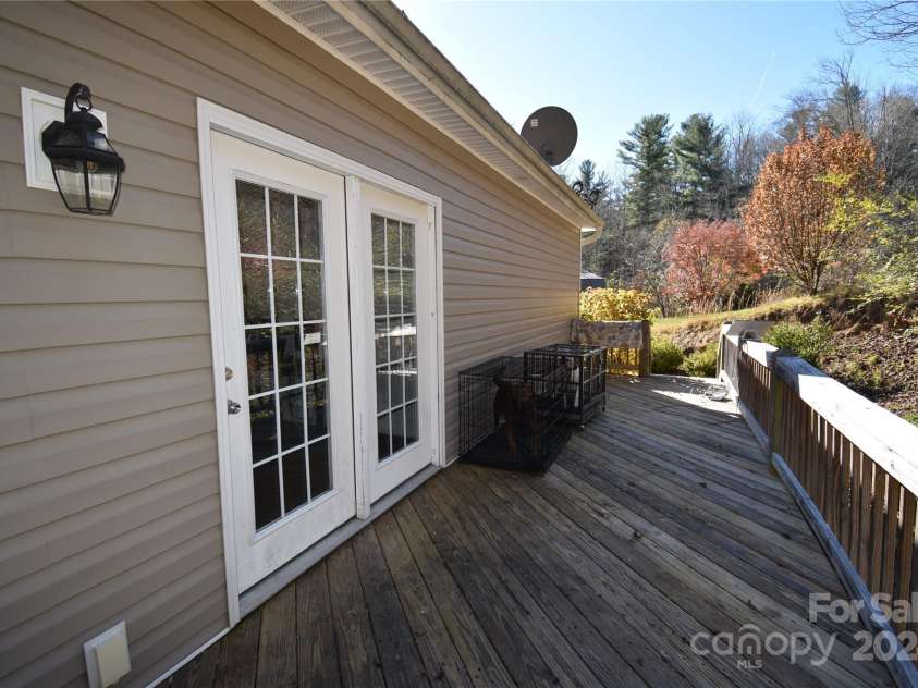 549 Freeman Creek Road, Zirconia, NC 28790.  MLS# CAR4203056, YatesRealty ID 12382. Back deck
