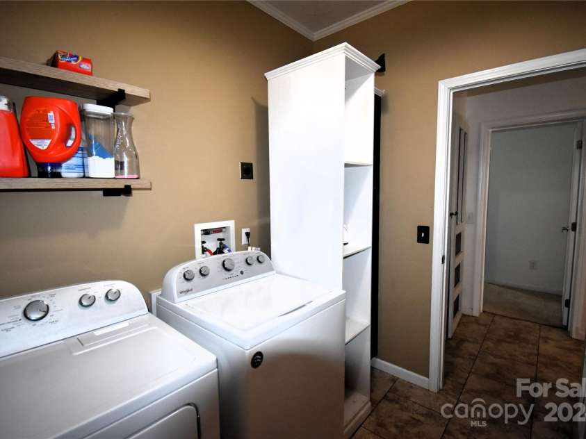 549 Freeman Creek Road, Zirconia, NC 28790.  MLS# CAR4203056, YatesRealty ID 12382. Laundry room