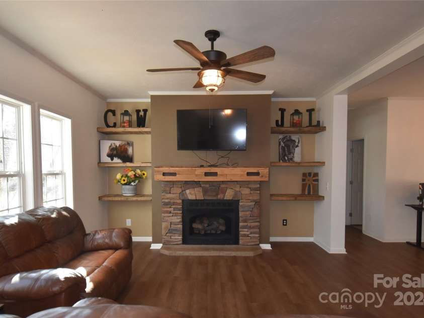 549 Freeman Creek Road, Zirconia, NC 28790.  MLS# CAR4203056, YatesRealty ID 12382. Living Room Fireplace
