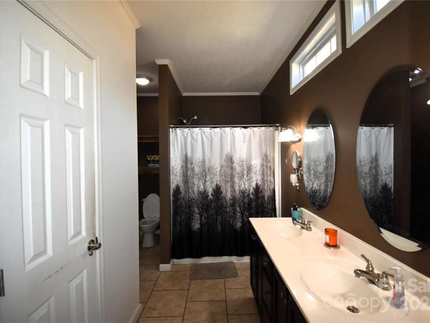 549 Freeman Creek Road, Zirconia, NC 28790.  MLS# CAR4203056, YatesRealty ID 12382. Primary bath
