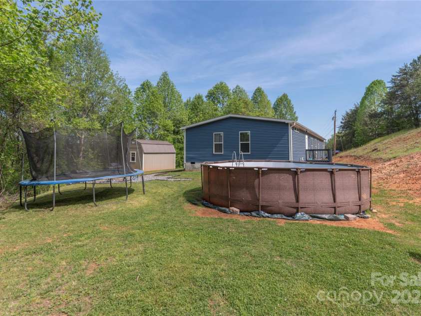 87 Horseback Lane, Marshall, NC 28753.  MLS# CAR4251023, YatesRealty ID 12384. Even room for a garden or more toys!