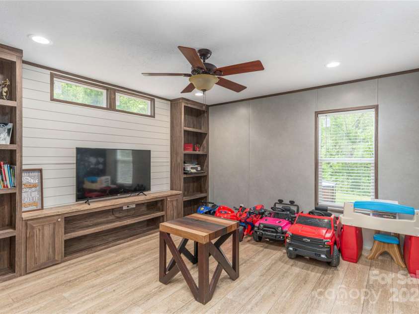 87 Horseback Lane, Marshall, NC 28753.  MLS# CAR4251023, YatesRealty ID 12384. Family den/playroom at end of home.  Tons of room to spread out.