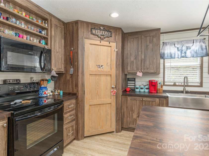 87 Horseback Lane, Marshall, NC 28753.  MLS# CAR4251023, YatesRealty ID 12384. Large pantry in corner