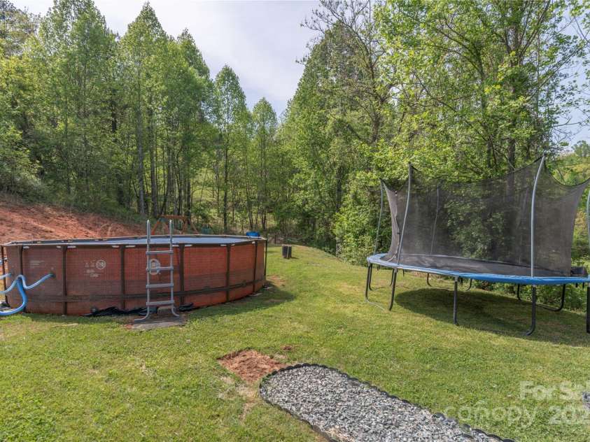 87 Horseback Lane, Marshall, NC 28753.  MLS# CAR4251023, YatesRealty ID 12384. Lots of play area at the end of the house!