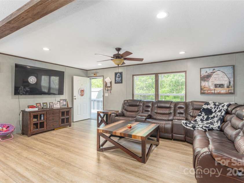 87 Horseback Lane, Marshall, NC 28753.  MLS# CAR4251023, YatesRealty ID 12384. Open and bright Living Room.