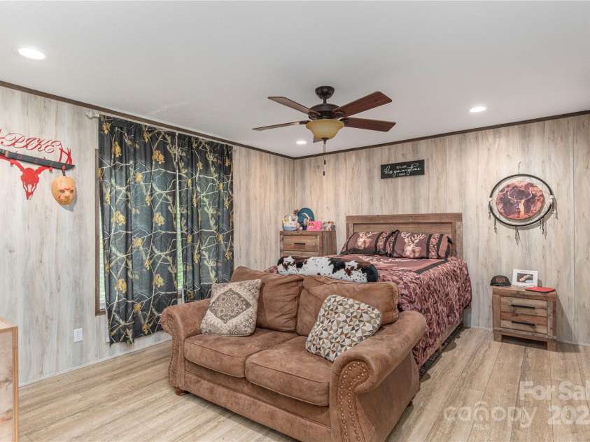 87 Horseback Lane, Marshall, NC 28753.  MLS# CAR4251023, YatesRealty ID 12384. Primary bedroom with en suite
