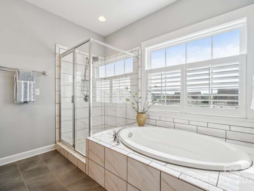 2311 Lochview Street, Pineville, NC 28134.  MLS# CAR4246576, YatesRealty ID 12385. Shower + Soaking Tub