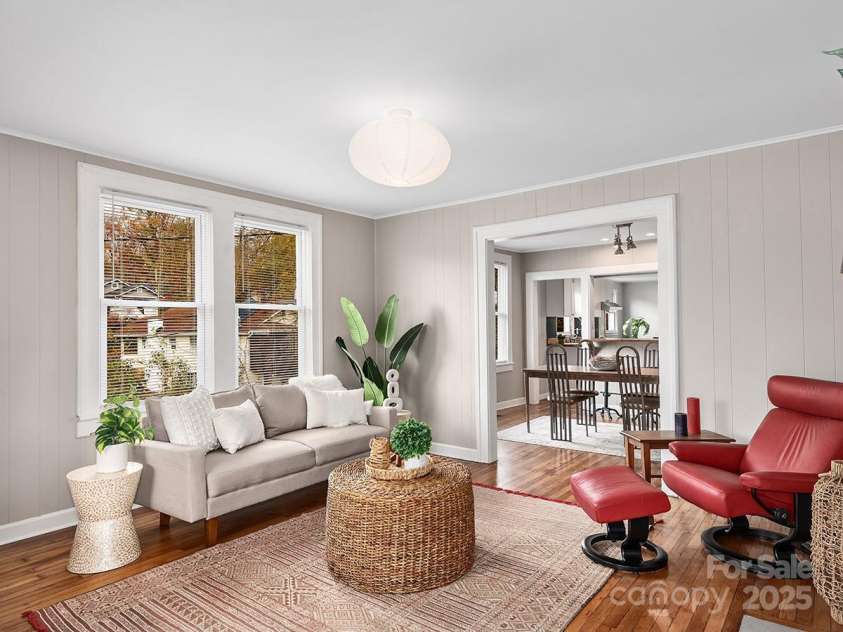 60 Fulton Street, Asheville, NC 28801.  MLS# CAR4196168, YatesRealty ID 12392. Light-filled living room opening into dining area.