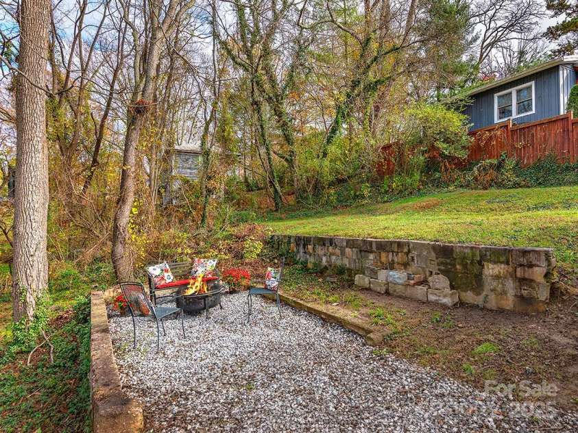 60 Fulton Street, Asheville, NC 28801.  MLS# CAR4196168, YatesRealty ID 12392. Two-level rear yard with area for fire pit gathering and back-yard playing.