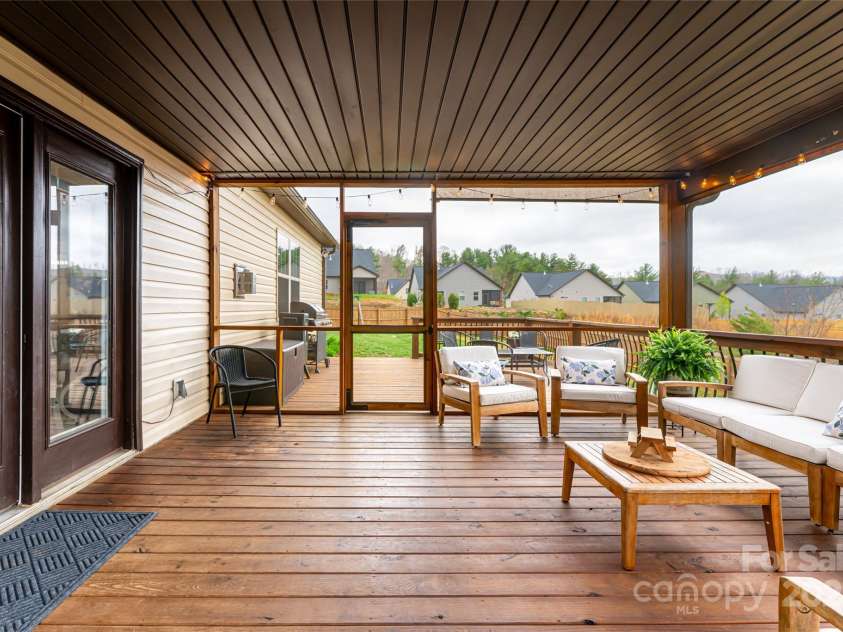 316 Wild Ginger Court, Weaverville, NC 28787.  MLS# CAR4245855, YatesRealty ID 12406. Screened in back porch with additional deck space in the sunshine.