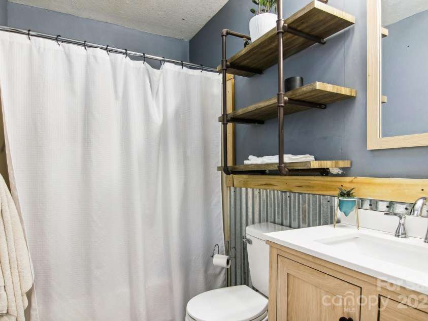 105 Big Bear Drive, Pisgah Forest, NC 28768.  MLS# CAR4192035, YatesRealty ID 12415. 2nd full bathroom on main level