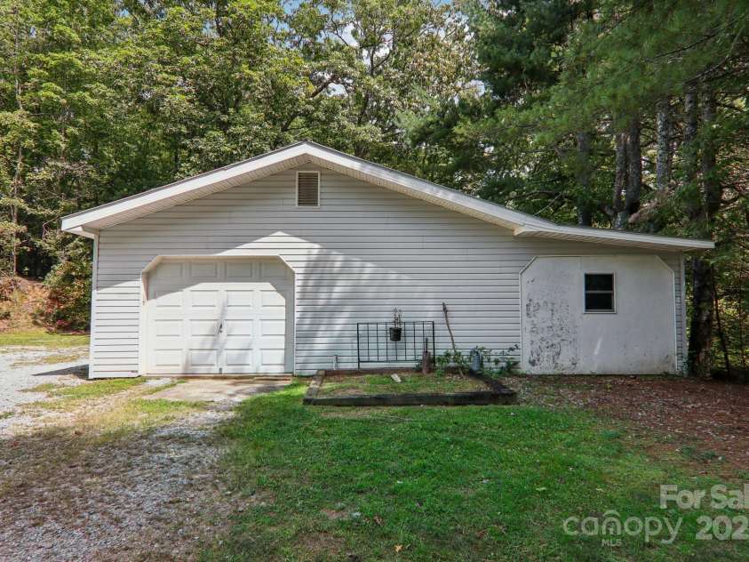 105 Big Bear Drive, Pisgah Forest, NC 28768.  MLS# CAR4192035, YatesRealty ID 12415. Detached workshop offers plenty of possibilities