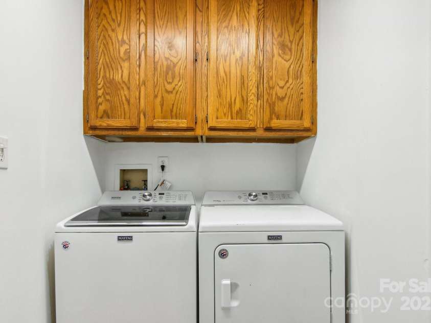 105 Big Bear Drive, Pisgah Forest, NC 28768.  MLS# CAR4192035, YatesRealty ID 12415. Laundry room off of primary bedroom/bathroom