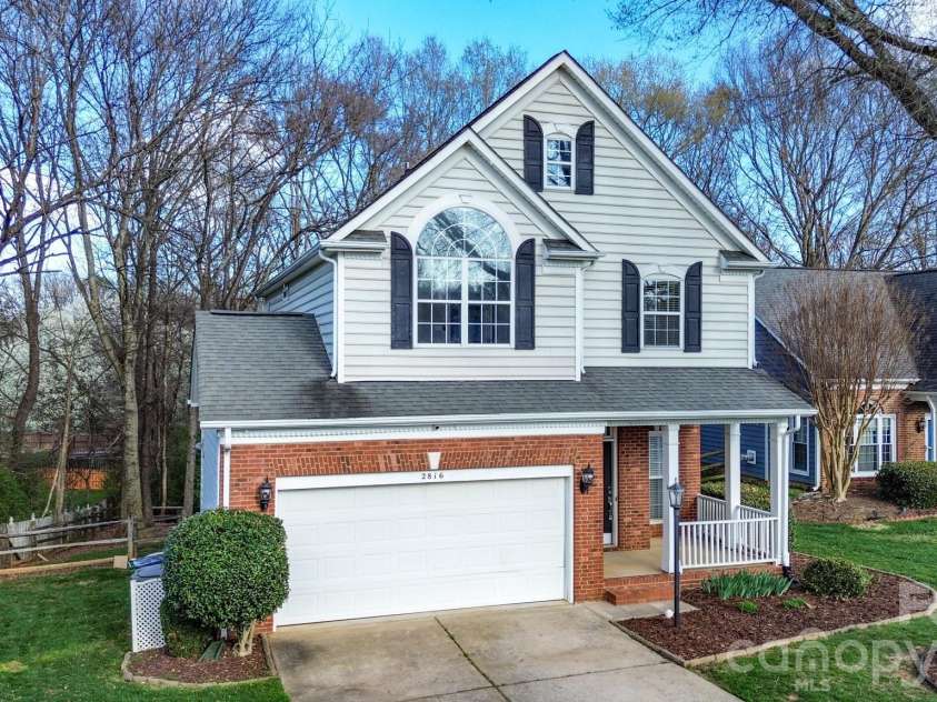 2816 Robyns Glen Drive, Charlotte, NC 28269.  MLS# CAR4340315, YatesRealty ID 12419. Front Yard and Driveway