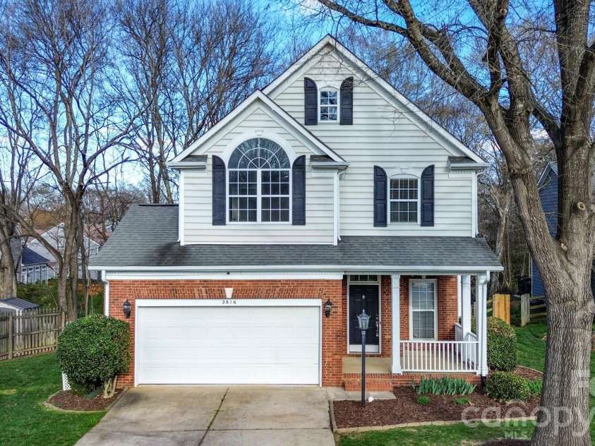 2816 Robyns Glen Drive, Charlotte, NC 28269.  MLS# CAR4340315, YatesRealty ID 12419. Front Yard and Driveway