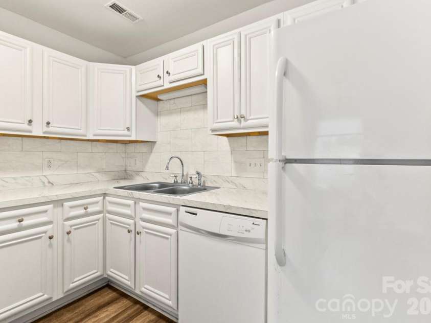 6041 Crape Myrtle Lane, Charlotte, NC 28216.  MLS# CAR4354736, YatesRealty ID 12425. Dishwasher and refrigerator