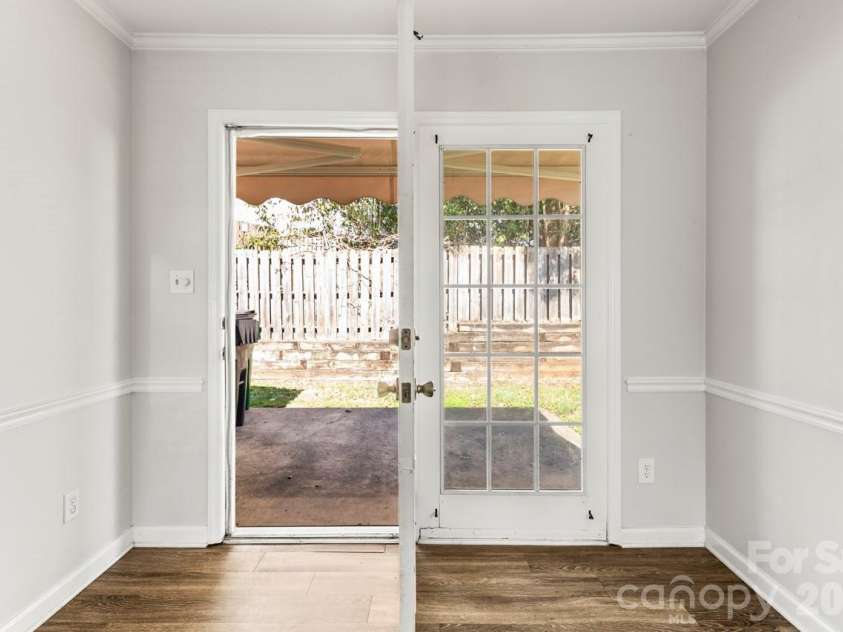 6041 Crape Myrtle Lane, Charlotte, NC 28216.  MLS# CAR4354736, YatesRealty ID 12425. Doors to back patio