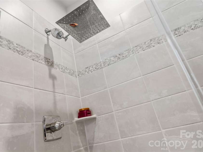 3149 Beeler Lane, Charlotte, NC 28208.  MLS# CAR4352531, YatesRealty ID 12426. Rainfall showerhead in primary bathroom
