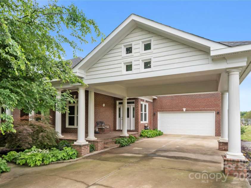 6218 Indian Trail Fairview Road, Indian Trail, NC 28079.  MLS# CAR4250864, YatesRealty ID 12442. Custom built home with hardwood floors, 2 car carport and 2 car garage