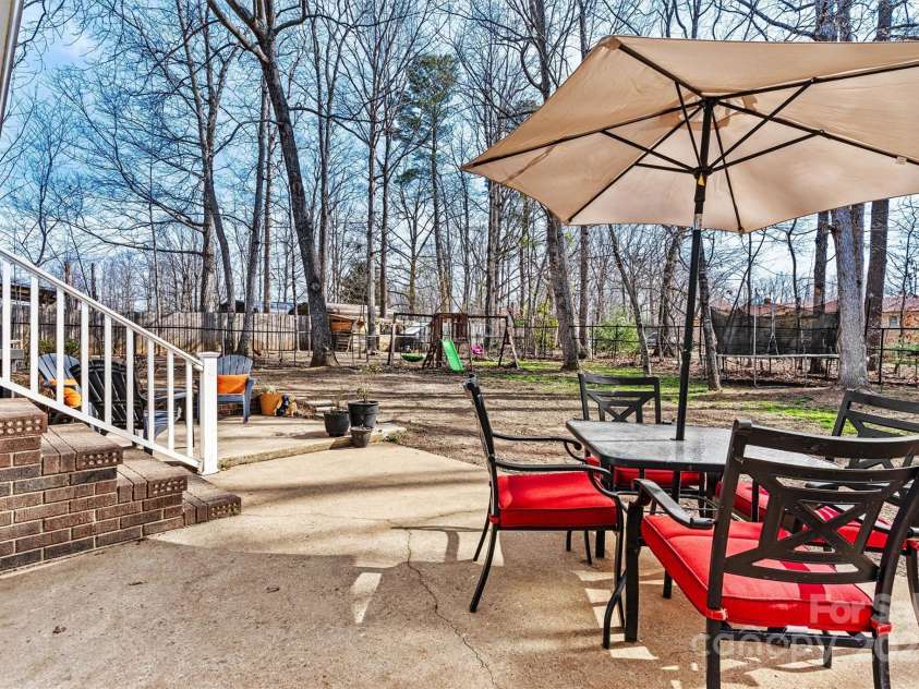 1140 Knollwood Drive, Claremont, NC 28610.  MLS# CAR4237158, YatesRealty ID 12447. Back Patio Focused View