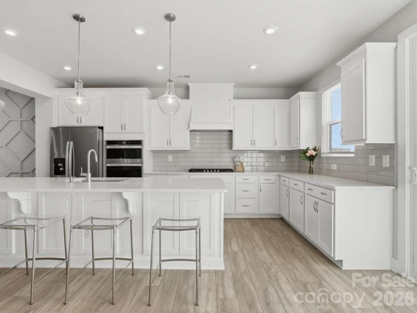 3309 Treble Court, Charlotte, NC 28262.  MLS# CAR4355630, YatesRealty ID 12451. Chef's kitchen w/ expansive island