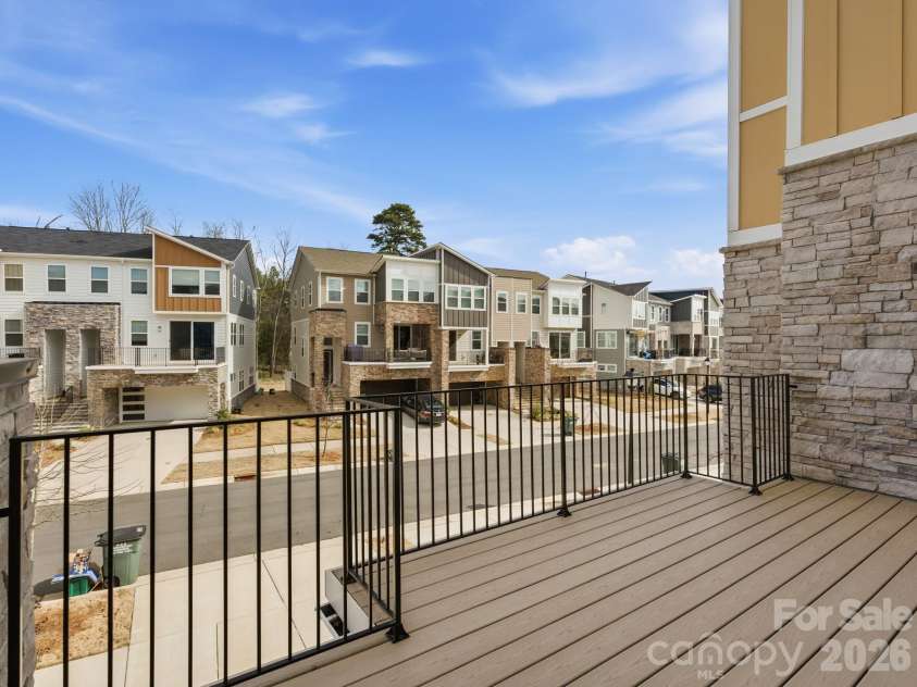 3309 Treble Court, Charlotte, NC 28262.  MLS# CAR4355630, YatesRealty ID 12451. Front balcony off living room 