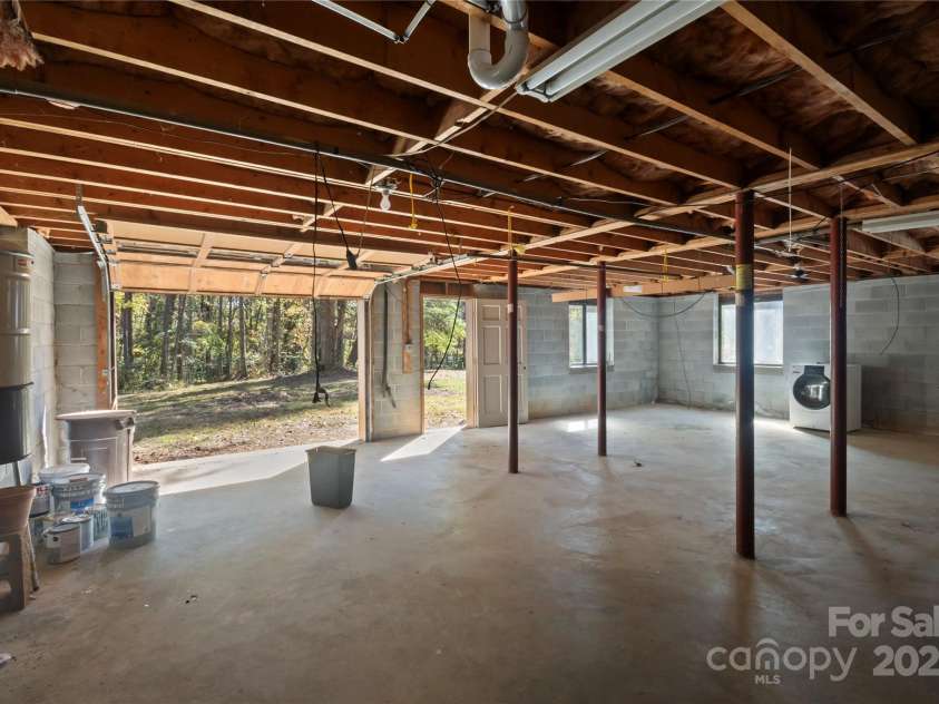 90 Joe Jenkins Road, Fairview, NC 28730.  MLS# CAR4288516, YatesRealty ID 12466. Basement: Garage and storing lawn equipment.*   Room: Finishing another bedroom.*   Bathroom: Plumber for bathroom installation.