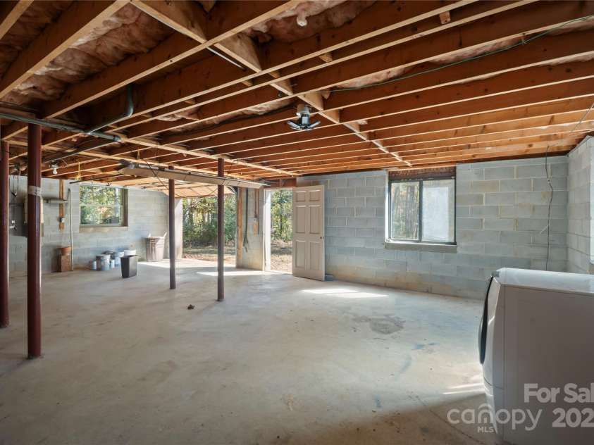 90 Joe Jenkins Road, Fairview, NC 28730.  MLS# CAR4288516, YatesRealty ID 12466. Basement: Garage and storing lawn equipment.*   Room: Finishing another bedroom.*   Bathroom: Plumber for bathroom installation.
