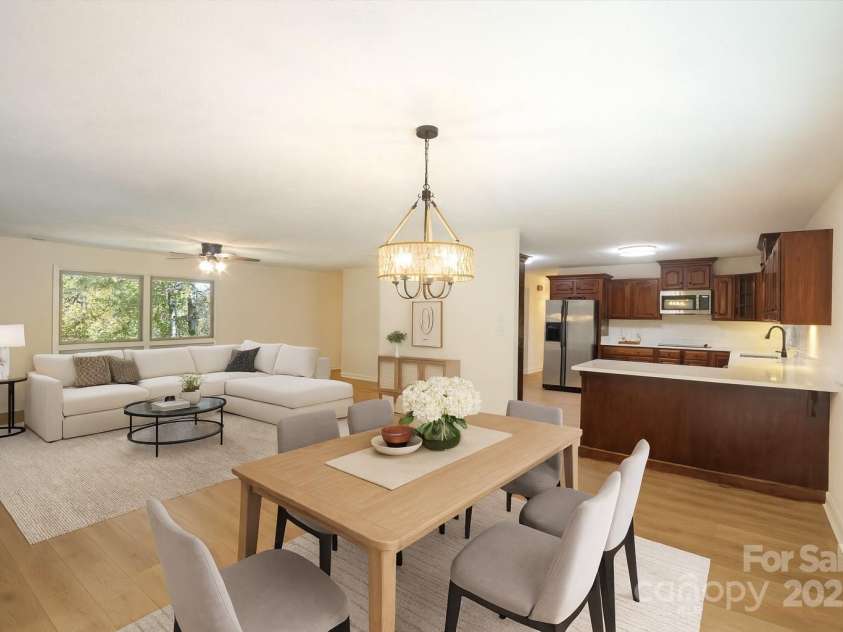 90 Joe Jenkins Road, Fairview, NC 28730.  MLS# CAR4288516, YatesRealty ID 12466. This home features a light, bright, and comfortable guest bedroom, perfect for overnight visitors. The room is designed to provide a relaxing and welcoming space, ensuring a pleasant stay for guests.