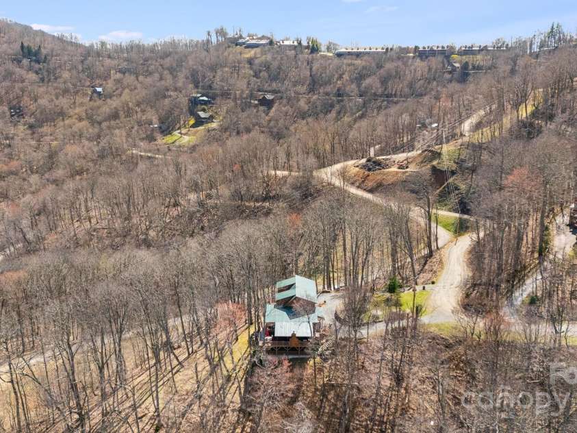 100 Flame Azalea Lane, Mars Hill, NC 28754.  MLS# CAR4248115, YatesRealty ID 12470. 100 Flame Azalea is just a short drive from the exceptional amenities of Wolf Laurel Country Club.