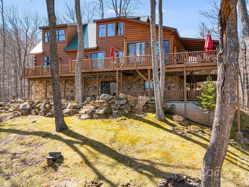 100 Flame Azalea Lane, Mars Hill, NC 28754.  MLS# CAR4248115, YatesRealty ID 12470. Backyard view of 100 Flame Azalea showcasing the abundant outdoor living spaces.