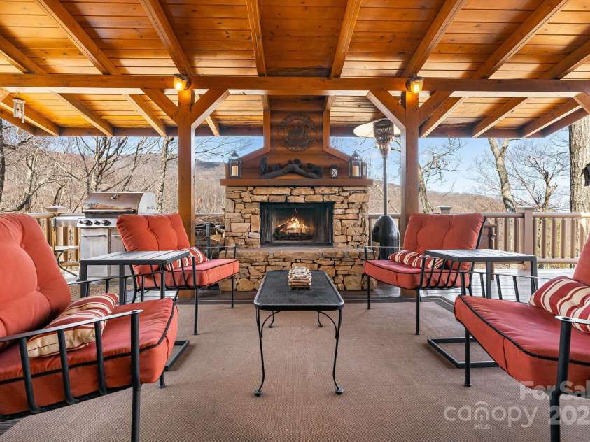 100 Flame Azalea Lane, Mars Hill, NC 28754.  MLS# CAR4248115, YatesRealty ID 12470. Enjoy the sounds of the nearby creek and the warmth of the wood-burning fireplace, with gas starter, create the perfect outdoor retreat.
