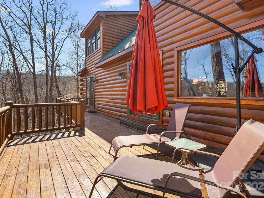 100 Flame Azalea Lane, Mars Hill, NC 28754.  MLS# CAR4248115, YatesRealty ID 12470. Enjoy your morning coffee & evening cocktails from the sun deck.