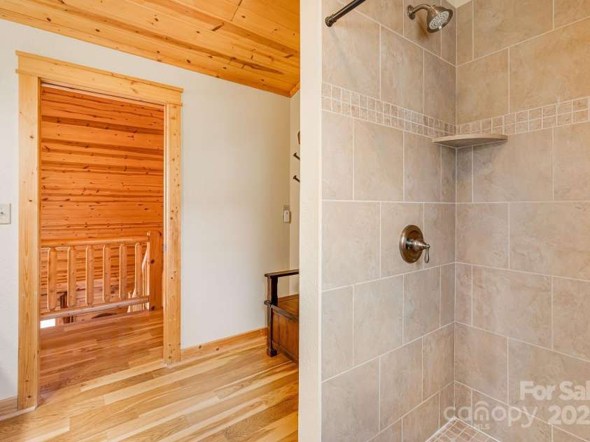 100 Flame Azalea Lane, Mars Hill, NC 28754.  MLS# CAR4248115, YatesRealty ID 12470. Upper level full bath with walk in tile shower.