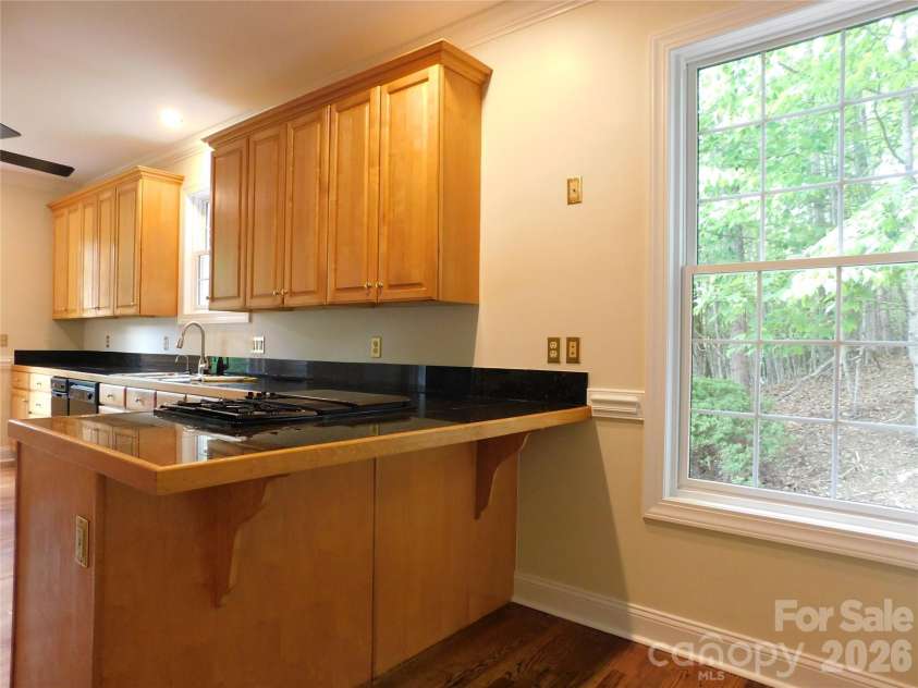 1064 Skye Drive, Pisgah Forest, NC 28768.  MLS# CAR4370821, YatesRealty ID 12470. Bar area for convenience and a quick bite.