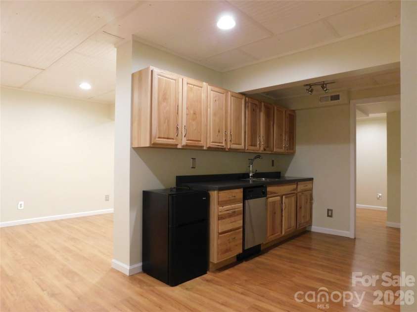 1064 Skye Drive, Pisgah Forest, NC 28768.  MLS# CAR4370821, YatesRealty ID 12470. Basement kitchenette.
