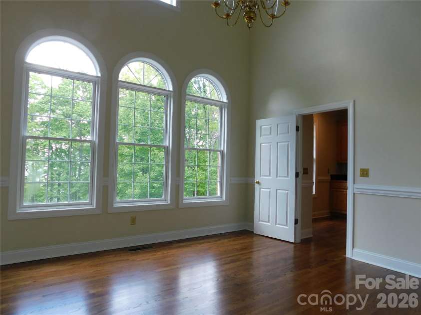 1064 Skye Drive, Pisgah Forest, NC 28768.  MLS# CAR4370821, YatesRealty ID 12470. Dining Room is bathed in natural light with gorgeous custom windows.