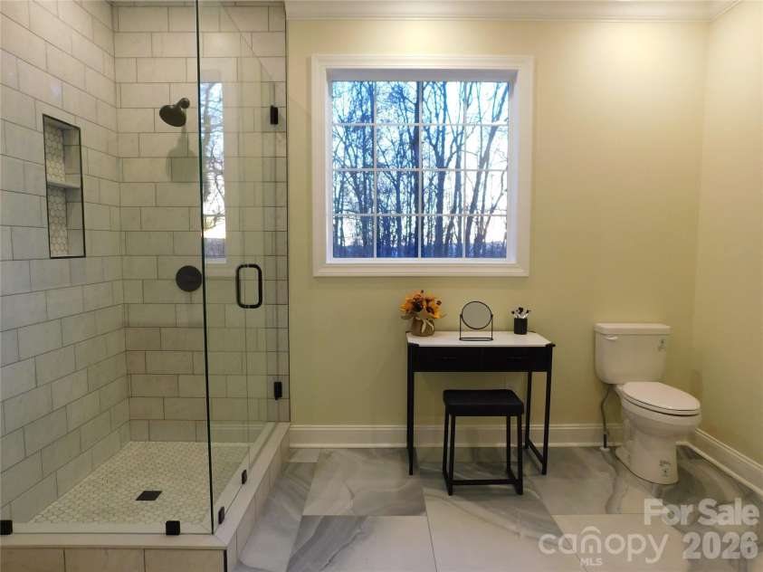 1064 Skye Drive, Pisgah Forest, NC 28768.  MLS# CAR4370821, YatesRealty ID 12470. Large window allows for natural light.