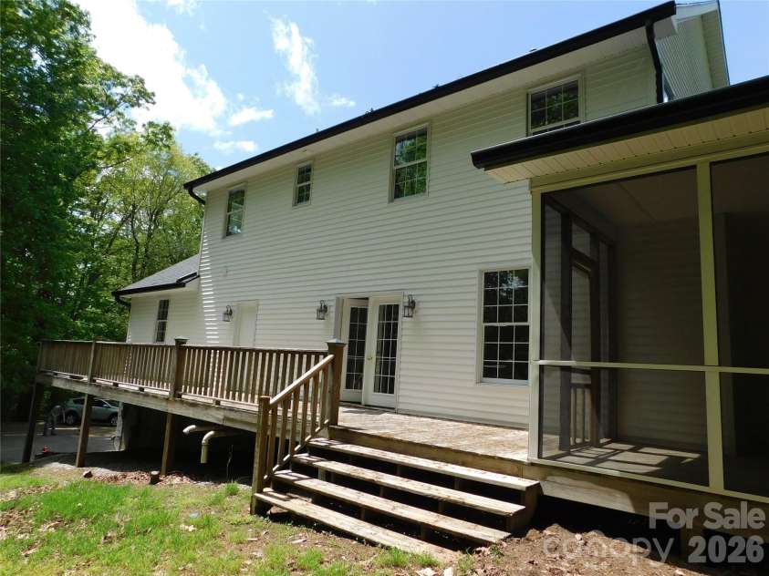 1064 Skye Drive, Pisgah Forest, NC 28768.  MLS# CAR4370821, YatesRealty ID 12470. Open back deck.  Possible for drive to extend to this entrace.