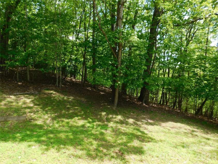 1064 Skye Drive, Pisgah Forest, NC 28768.  MLS# CAR4370821, YatesRealty ID 12470. Peaceful back yard.