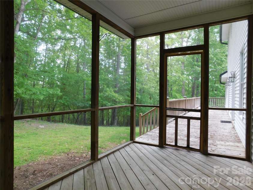1064 Skye Drive, Pisgah Forest, NC 28768.  MLS# CAR4370821, YatesRealty ID 12470. Screened-in porch just off kitchen.