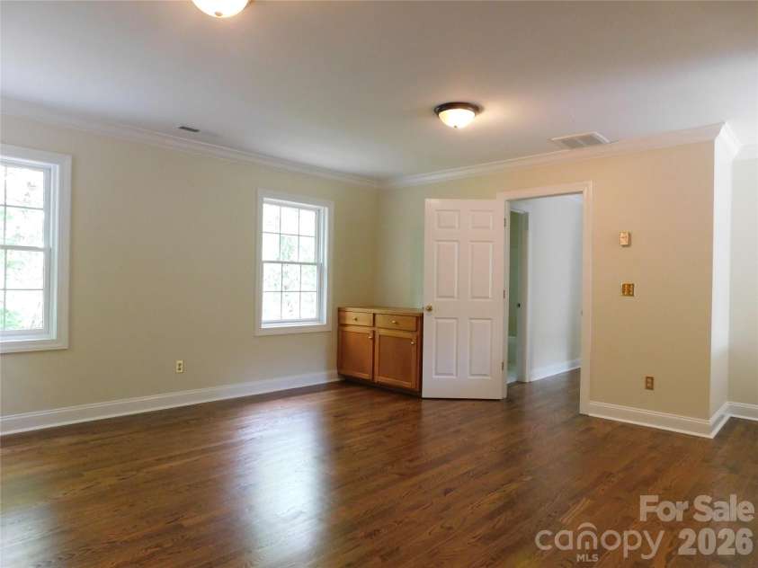 1064 Skye Drive, Pisgah Forest, NC 28768.  MLS# CAR4370821, YatesRealty ID 12470. Upstairs living room has built-ins for storage.